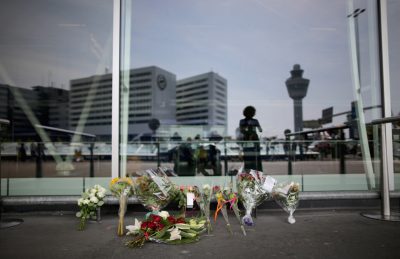 Floral tributes adorn the entrance to Amsterdam's Schiphol Airport memory of the victims of Air Malaysia flight MH17 on July 18, 2014. Air Malaysia flight MH17 travelling from Amsterdam to Kuala Lumpur crashed yesterday on the Ukraine/Russia border near the town of Shaktersk. The Boeing 777 was carrying 298 people including crew members, the majority of the passengers being Dutch nationals, believed to be at least 173, 44 Malaysians, 27 Australians, 12 Indonesians and 9 Britons. (Christopher Furlong/Getty Images)