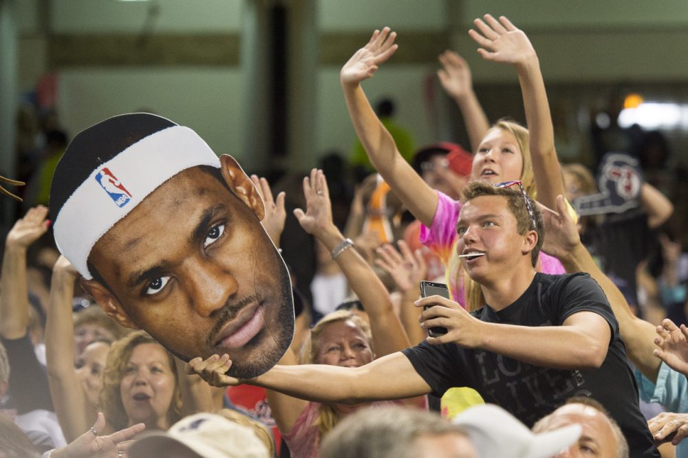 Cleveland sports fans are celebrating the return of LeBron, but will King James really add $500 million to the local economy? (Jason Miller/Getty Images)