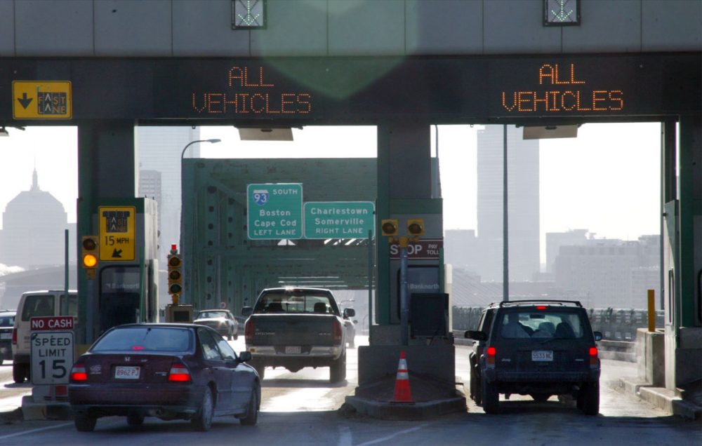 Motorists pass through toll booths on the Tobin Bridge in Boston on Jan. 15, 2004. (Robert Spencer/AP)