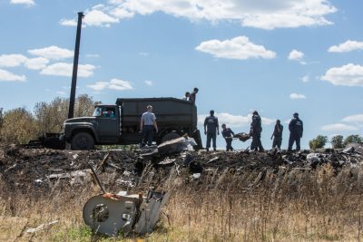 Personnel from the Ukrainian Emergencies Ministry load the bodies of victims of Malaysia Airlines flight MH17 into a truck at the crash site on July 21, 2014 in Grabovo, Ukraine. Malaysia Airlines flight MH17 was travelling from Amsterdam to Kuala Lumpur when it crashed killing all 298 on board including 80 children. The aircraft was allegedly shot down by a missile and investigations continue over the perpetrators of the attack. (Brendan Hoffman/Getty Images)
