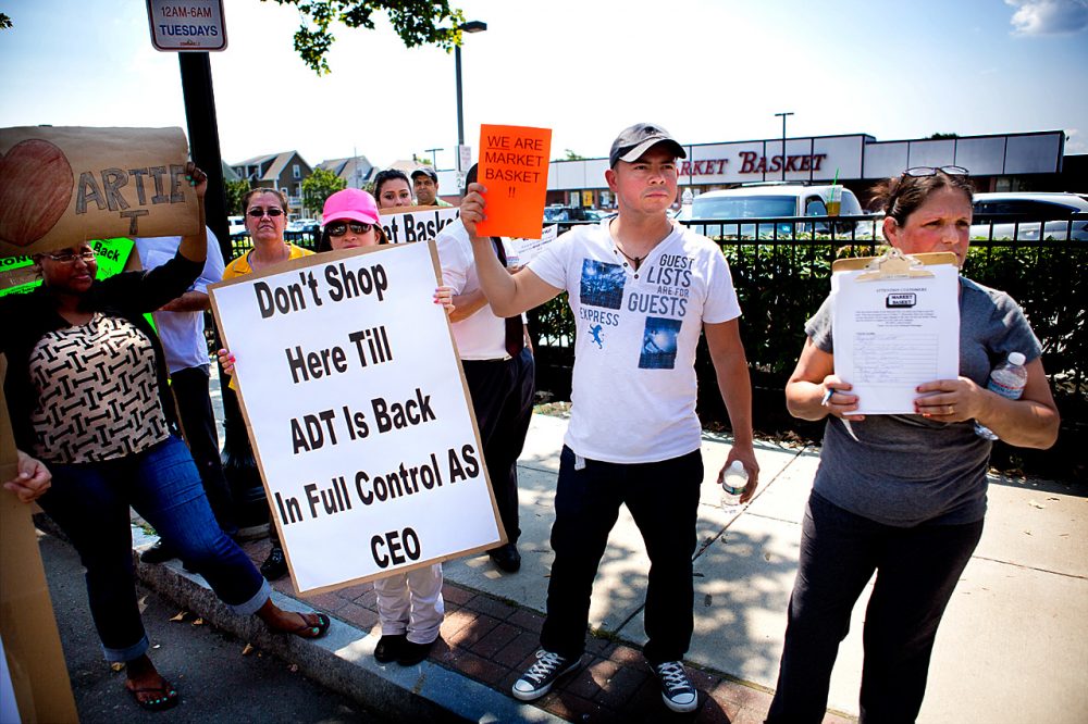 Market Basket employees protested outside of the Somerville store near Union Square Tuesday afternoon. At a rally in Tewksbury Monday, protest organizers urged employees to take their fight to have Arthur T. reinstated back to their own stores. (Jesse Costa/WBUR)