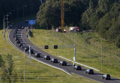 A convoy of funeral hearses carrying coffins containing the remains of victims of the downed Malaysia Airlines flight MH17, drives from the Eindhoven Airbase to Hilversum on July 23, 2014. (Jerry Lampen/AFP/Getty Images)