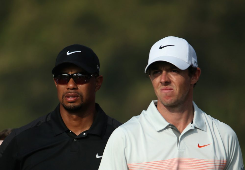 Tiger Woods (left) finished 69th at the 2014 British Open, which was won by Rory McIlroy (right). (Warren Little/Getty Images)