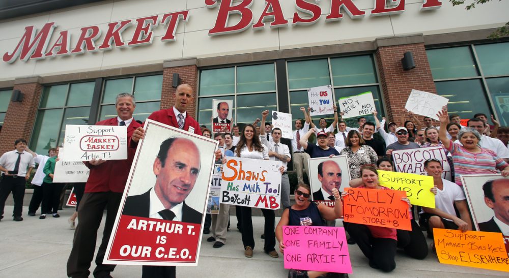 Thomas Kochan: &quot;Unless there is a change of course... all parties -- owners, employees and customers -- will lose.&quot;  Pictured: Market Basket assistant managers Mike Forsyth, left, and John Surprenant, second from left, hold signs while posing with employees in Haverhill, Mass., Thursday, July 24, 2014, in a show of support for Arthur T. Demoulas. The former chief executive of the Market Basket supermarket chain whose ouster has led to employee protests, customer boycotts and empty shelves, says he wants to buy the entire company. (AP)