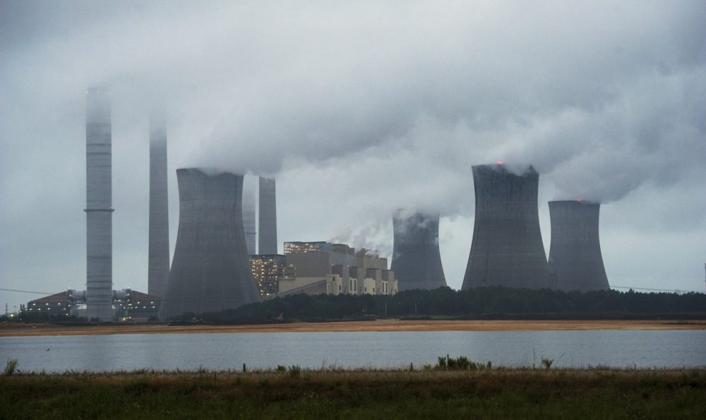 The coal-fired Plant Scherer is shown in operation early Sunday, June 1, 2014, in Juliette, Ga. Congress is considering a bill that would create a carbon tax and divide the revenue among the American public. (John Amis/AP)