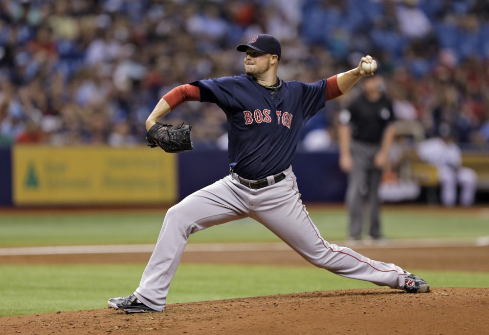 Boston Red Sox starting pitcher Jon Lester delivers to Tampa Bay Rays during the sixth inning of a game Friday, July 25. (Chris O'Meara/AP)