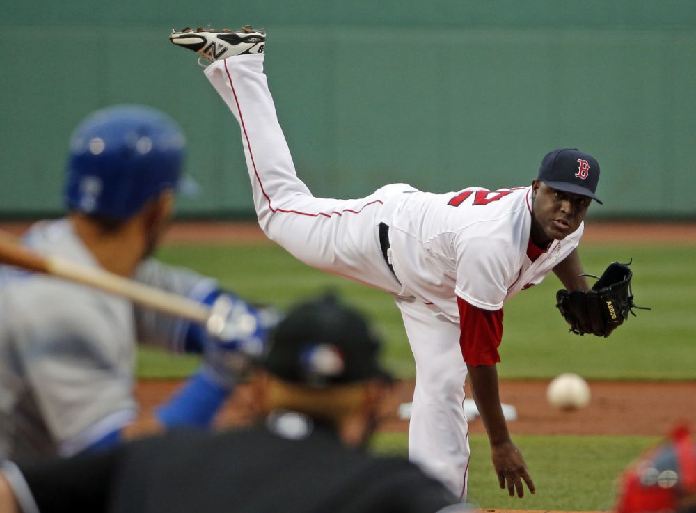 Boston Red Sox starting pitcher Rubby De La Rosa delivers to the Toronto Blue Jays during the first inning of a baseball game at Fenway Park in Boston, Tuesday, July 29, 2014. (Elise Amendola/AP)
