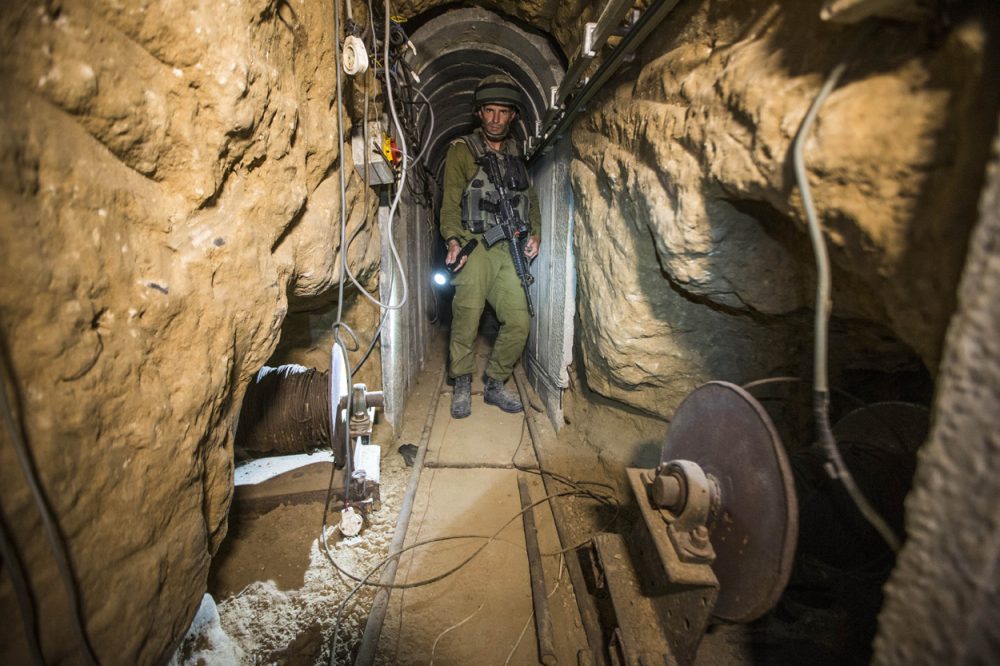 An Israeli army officer gives journalists a tour of a tunnel at the Israel-Gaza Border allegedly used by Palestinian militants for cross-border attacks. (Jack Guez/AP/Pool)