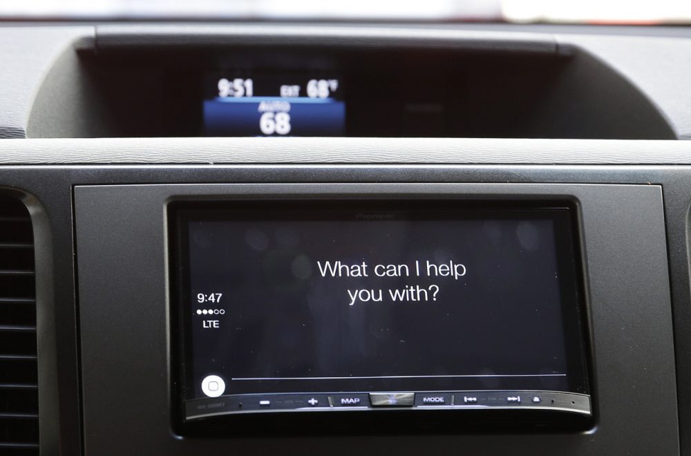 The new Apple CarPlay, featuring Siri voice control, asks a driver a question during a demonstration in San Francisco. (AP Photo/Eric Risberg)