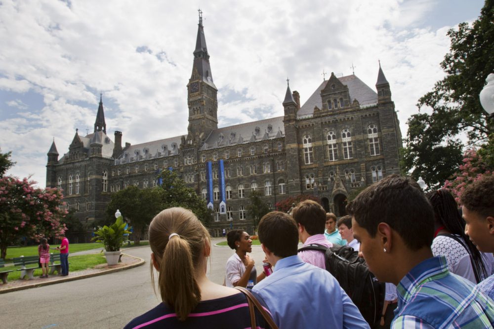In this July 10, 2013, file photo, prospective students tour Georgetown University's campus in Washington. Despite all the grumbling about tuition increases and student loan costs, other college expenses also are going up. The price of housing and food trumps tuition costs for students who attend two- and four-year public universities in their home states. That’s according to a College Board survey. Even with the lower interest rates on student loans that President Barack Obama signed into law, students are eyeing bills that are growing on just about every line. (AP)