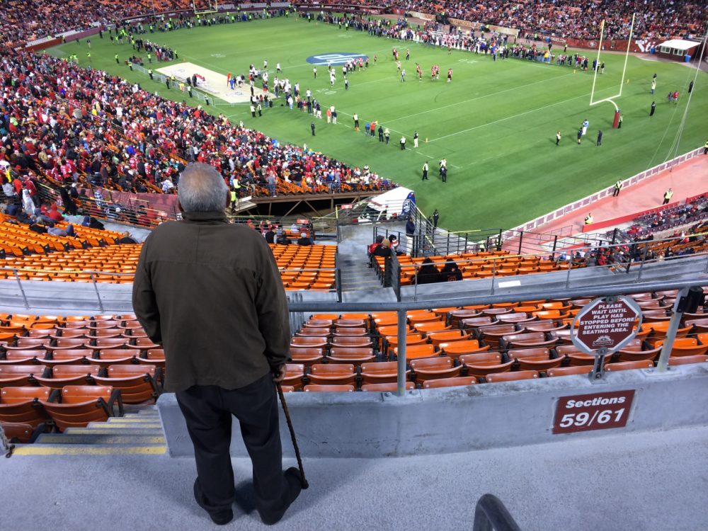 49ers fan John Barberini takes in second-half action during last week's &quot;Legends of Candlestick&quot; flag football game. (Dan Brekke)