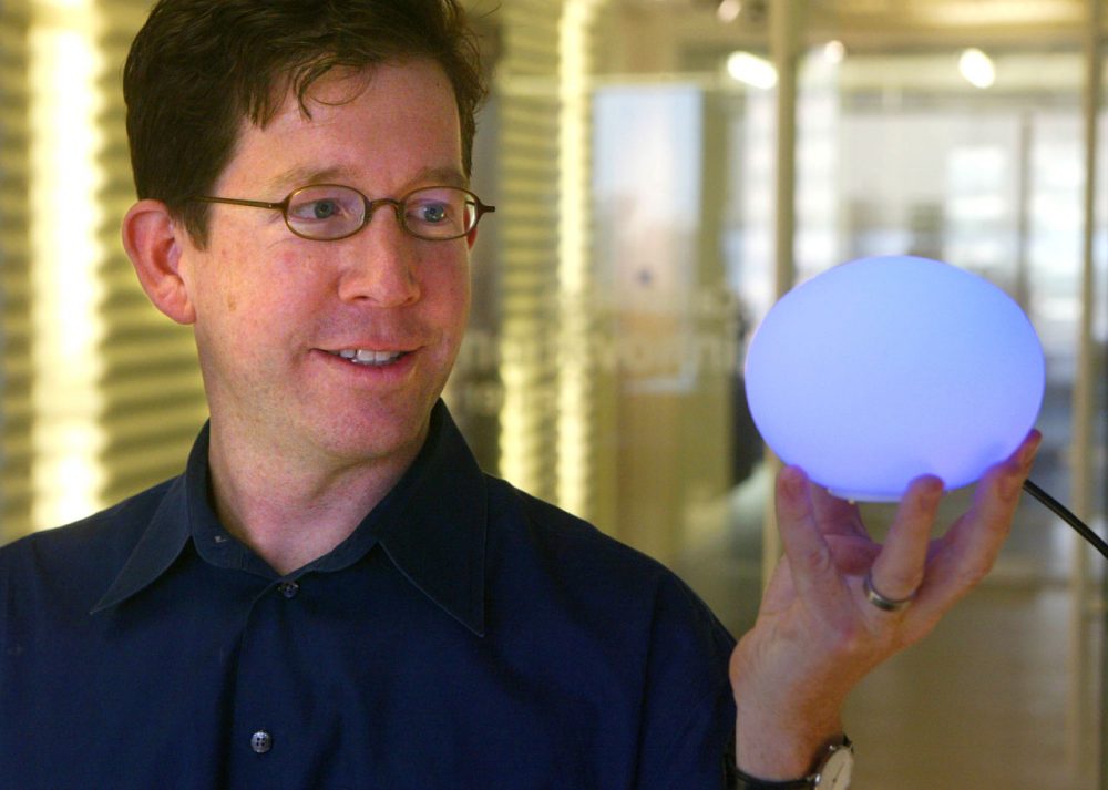 David Rose displays an Ambient Orb, which changes colors to reflect trends in information on a particular subject which is transmitted via the Internet. (Robert Spencer/AP)