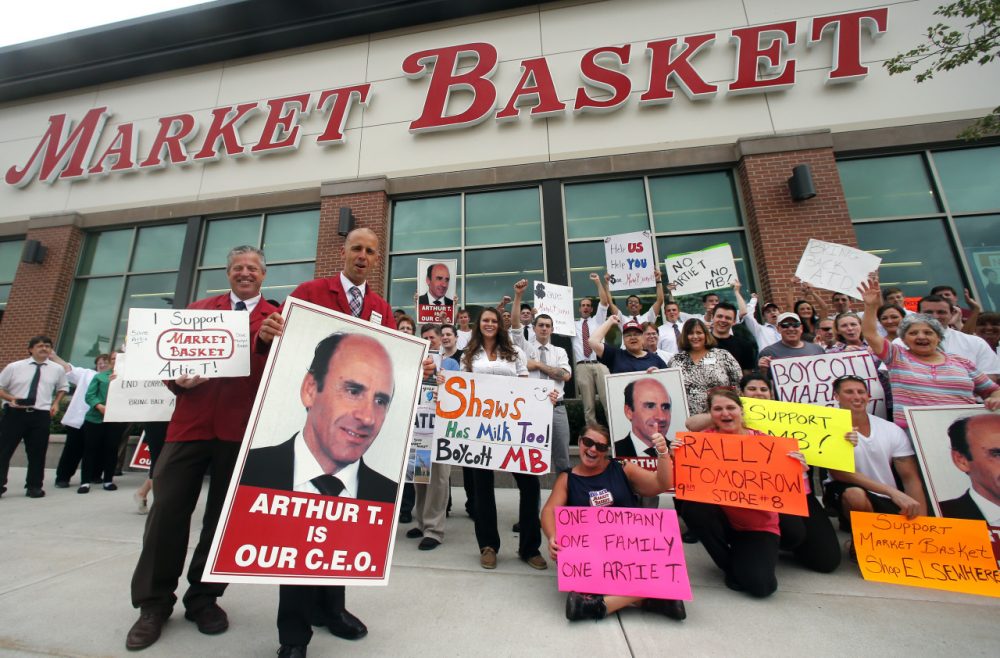 Market Basket employees face an ultimatum to return to work today without fear of penalty. Market Basket employees are pictured here on July 25 in Haverhill in a show of support for Arthur T. Demoulas, the former chief executive of the supermarket chain.(AP)