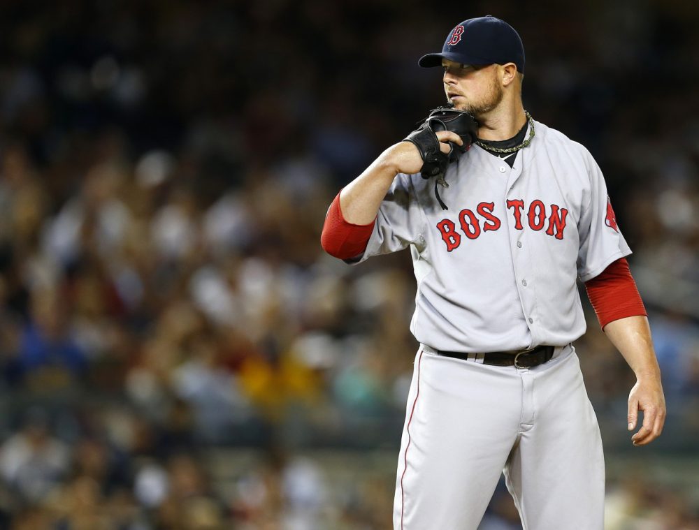 Red Sox ace Jon Lester was dealt to the Oakland A's at the trade deadline. Fellow pitchers John Lackey and Andrew Miller, as well as shortstop Stephen Drew, were also traded away. (Rich Schultz/Getty Images)