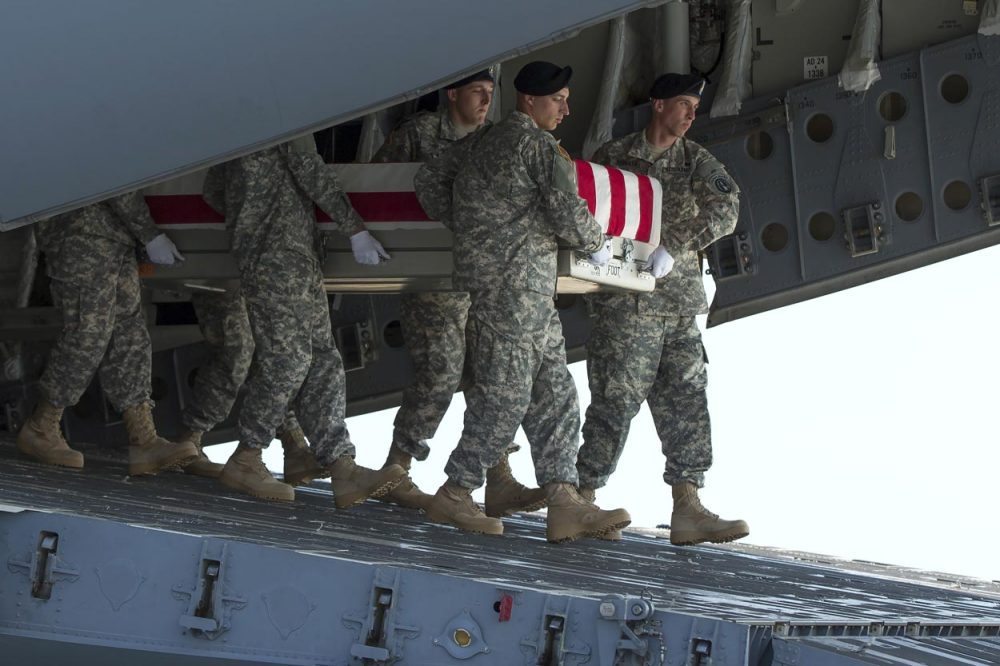 An Army carry team transfers the remains of Army Maj. Gen. Harold Greene at Dover Air Force Base in Delaware Thursday. (Evan Vucci/AP)
