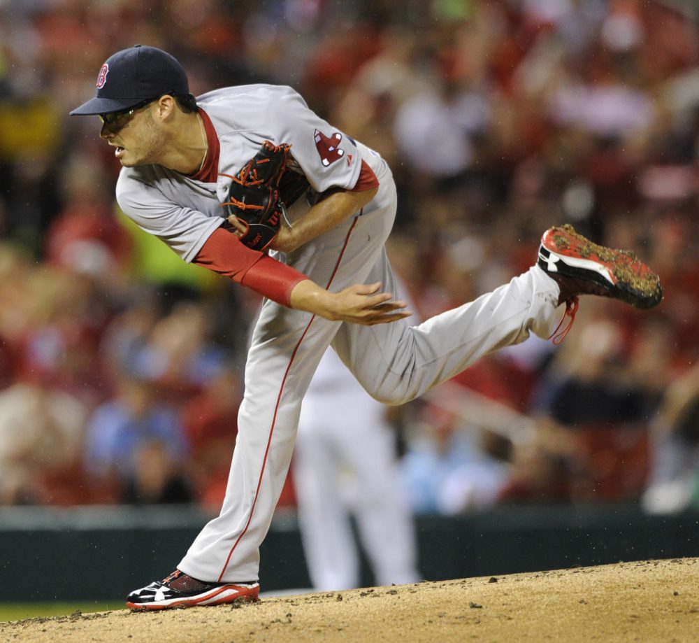 Red Sox's starting pitcher Joe Kelly (56) throws against the St. Louis Cardinal. (AP Photo/Bill Boyce)
