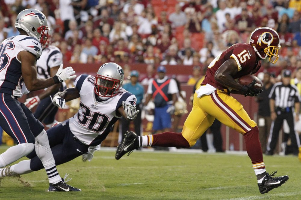 Redskins wide receiver Aldrick Robinson breaks free from New England Patriots strong safety Duron Harmon (30) and scores a touchdown. (AP/Alex Brandon)