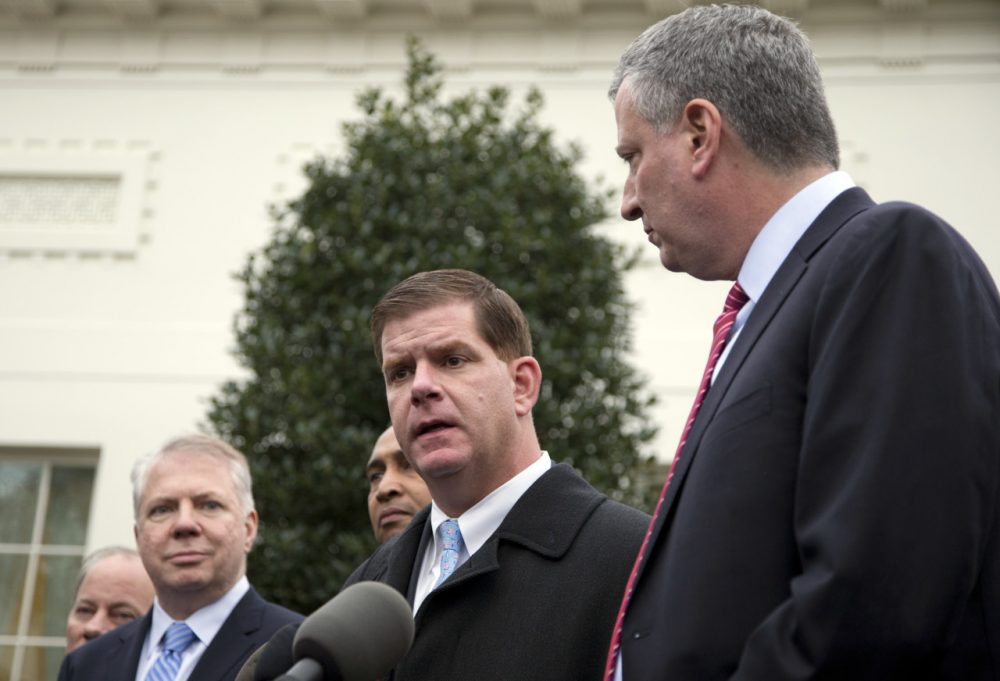 Boston Mayor Walsh speaks as Seattle Mayor Ed Murray and New York Mayor Bill de Blasio join him to speak to the media outside the West Wing of the White House. (Carolyn Kaster/AP)