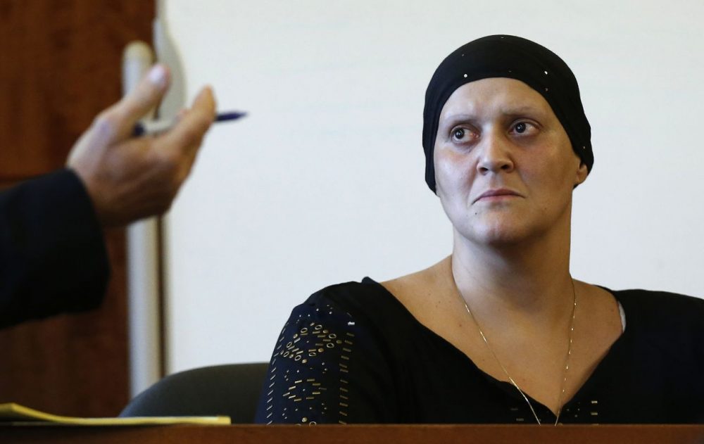 Tanya Singleton sits on the witness stand as her lawyer E. Peter Parker speaks during a hearing in Fall River Superior Court in Fall River, Mass. (Michael Dwyer, Pool/AP)