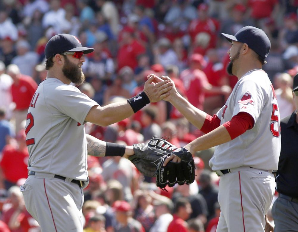 Mike Napoli and pitcher Edward Mujica congratulate each other after the Red Sox beat the Cincinnati Reds 5-4 Wednesday in Cincinnati.  (David Kohl/AP)