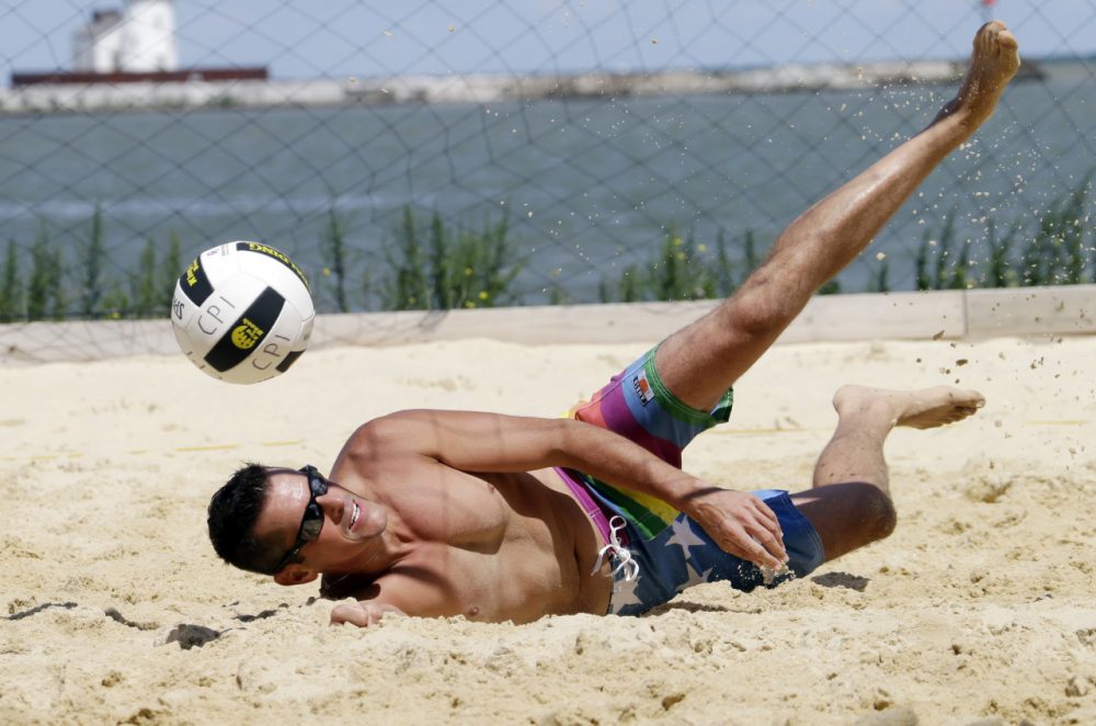 Todd Roark of Detroit dives during the beach volleyball competition at the Gay Games in Cleveland. (Mark Duncan/AP) 