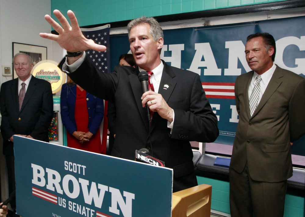 Former Mass. Senator and current Republican U.S. Senate candidate for N.H., Scott Brown, speaks on the campaign trail in August. (Jim Cole/AP)