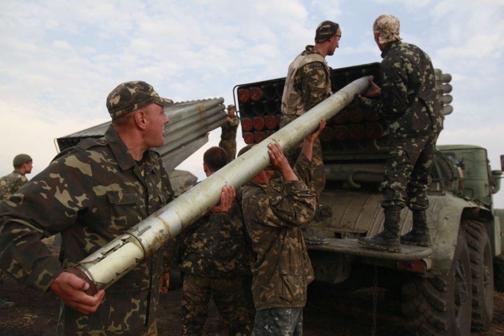 Ukrainian soldiers load a Grad missile during fighting with pro-Russian separatists close to Luhansk, eastern Ukraine, on Monday. (Petro Zadorozhnyy/AP)