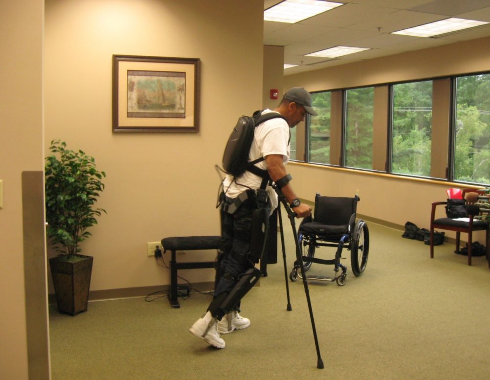 Gene Laureano, a 51-year-old Army veteran from the Bronx, uses the ReWalk exoskeleton. (WBUR/Sacha Pfeiffer)