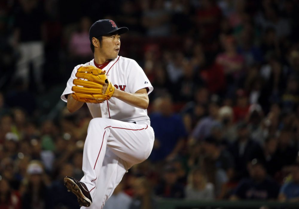 Boston Red Sox relief pitcher Koji Uehara pitches. (AP/Elise Amendola)