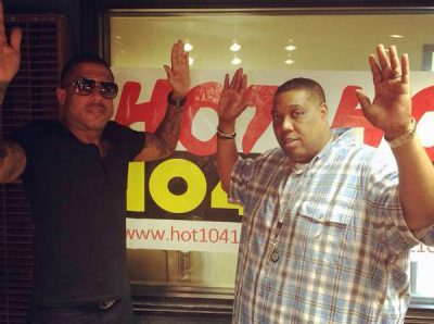 Radio station Hot 104.1 St. Louis tweeted this photo of DJ Boogie D (right) and record producer Benzino making the &quot;hands up don't shoot&quot; pose. (Twitter)