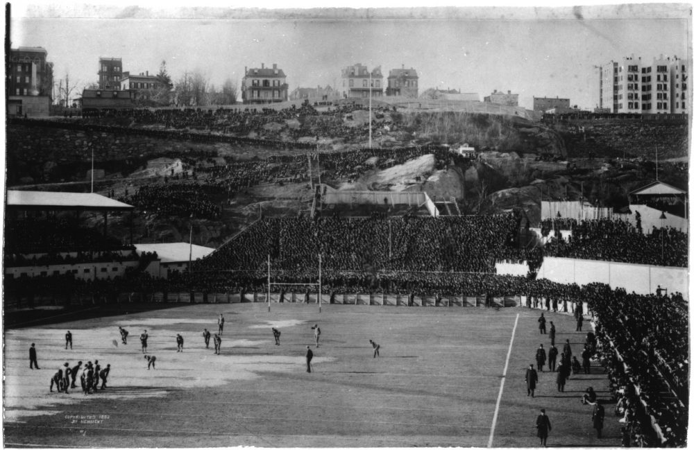 With 50,000 fans watching, Princeton's Phil King places the ball at midfield to begin the 1893 game against Yale.  The Tigers are aligned in a flying wedge. (Courtesy of Manuscripts and Archives, Yale University Library)
