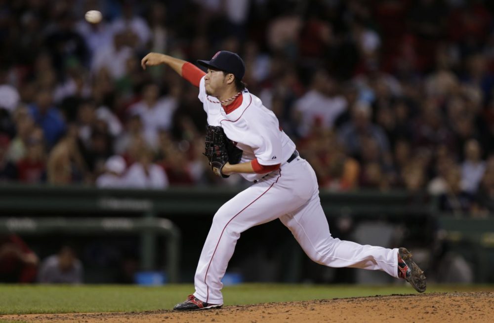 Boston Red Sox relief pitcher Junichi Tazawa (36) delivers during the eighth inning of a baseball game at Fenway Park in Boston on Thursday. (Charles Krupa/AP)