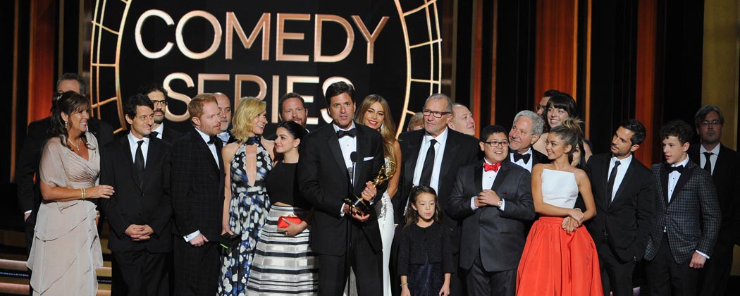 Steven Levitan, center, and the producers and cast of “Modern Family” accept the award for outstanding comedy series. (Vince Bucci/Invision/AP)