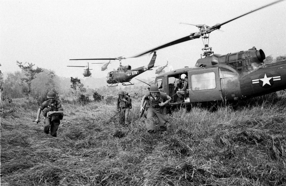 American soldiers are dropped off by U.S. Army helicopters during the Vietnam War. (Horst Faas/AP)