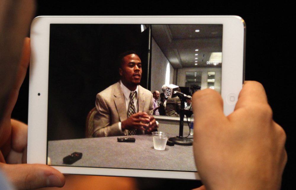 A reporter films Alabama wide receiver Christion Jones on his IPad as he speaks to media at the Southeastern Conference NCAA college football media days on Thursday, July 17, 2014, in Hoover, Ala. (AP)