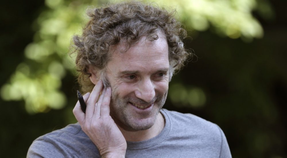 Peter Theo Curtis talks with reporters outside his mother's home in Cambridge, Mass. (Charles Krupa/AP)