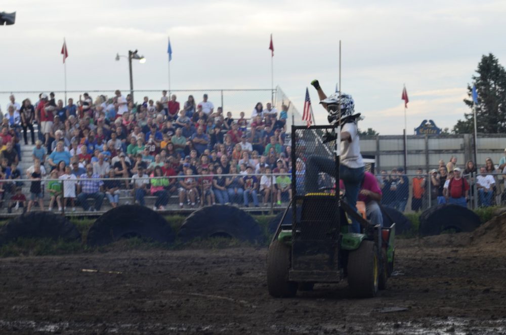 An exuberant winner of one of the heats at the Lawnmower Demolition Derby in Zumbrota, Minn. (Todd Melby/Only A Game)