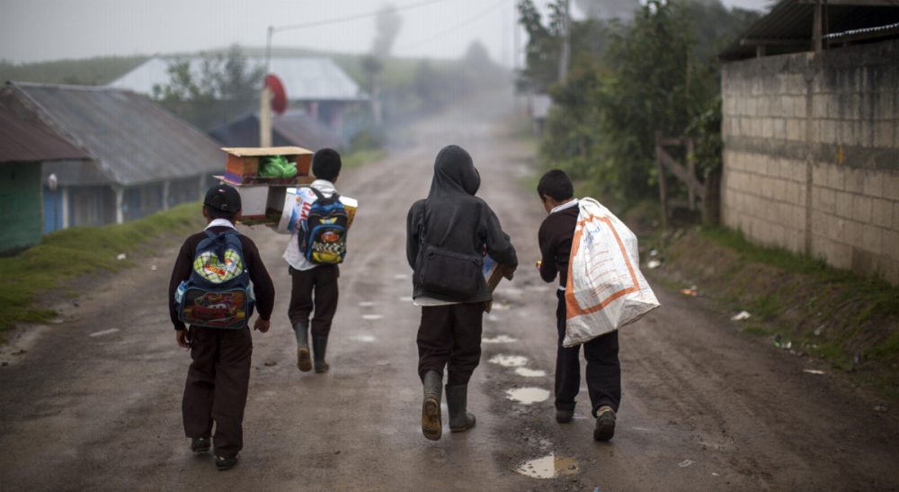 Simon Waxman: &quot;Tens of thousands of young people are fleeing Honduras, El Salvador and Guatemala thanks to America’s war on drugs.&quot; Pictured: Students walk after school in the community of San Jose Las Flores in the northern Cuchumatanes mountains of Guatemala, Tuesday, July 1, 2014. In this small community, Gilberto Francisco Ramos Juarez was born, a Guatemalan boy whose decomposed body was found in the Rio Grande Valley of South Texas. The number of unaccompanied immigrant children picked up along the border has been rising for three years as they flee pervasive gang violence in Honduras, Guatemala and El Salvador. (Luis Soto/AP)