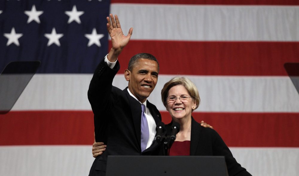President Barack Obama hugs then-senatorial candidate Elizabeth Warren during a 2012 campaign fundraiser at Symphony Hall in Boston. (AP/Stephan Savoia)