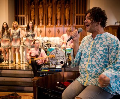 The Polyphonic Spree perform at the Marsh Chapel at Boston University. (Jesse Costa/WBUR)