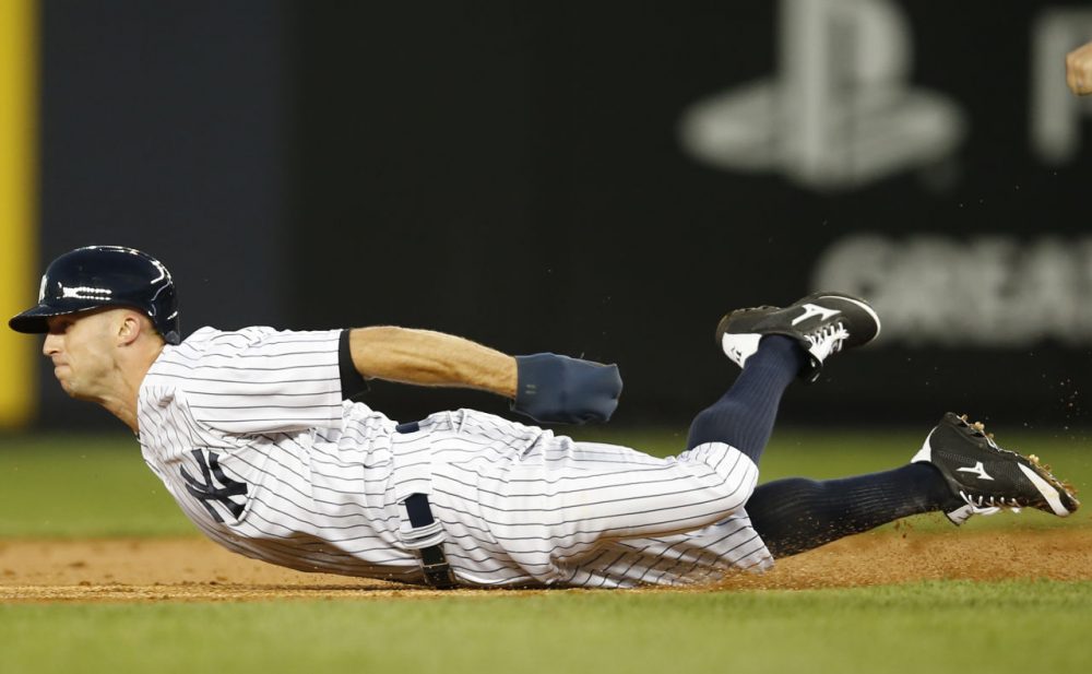 New York Yankees Brett Gardner (11) slides on his belly into second where he was tagged out on a double-steal attempt that turned into a double play in the first inning of a baseball game against the Boston Red Sox at Yankee Stadium. (Kathy Willens/AP)