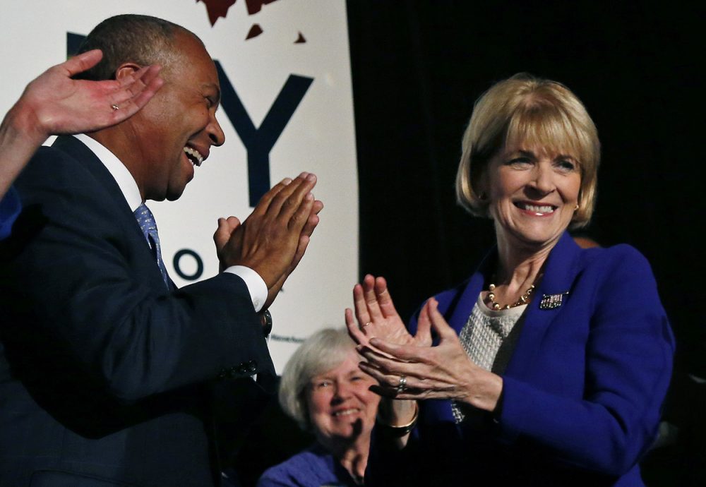 Martha Coakley celebrates her Democratic primary win with Gov. Deval Patrick. (Elise Amendola/AP)