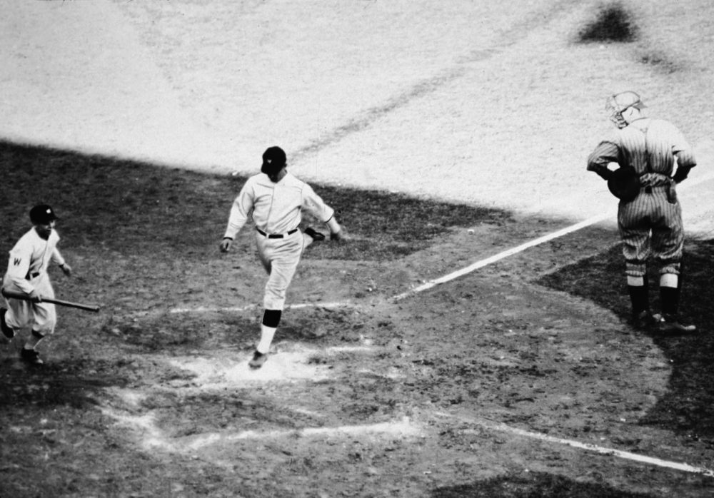 Player-manager Bucky Harris crosses home plate after hitting a home run in Game 7 of the 1924 World Series. (APA/Getty Images)