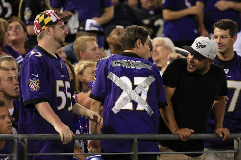 Thursday night's Baltimore Ravens game required some last minute adjustments. At least one fan altered his jersey while CBS made changes to its broadcast. (Rob Carr/Getty Images)