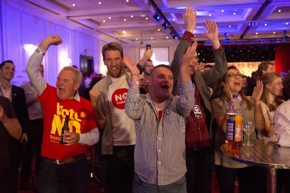 No supporters for the Scottish independence referendum celebrate an early result at a No campaign event at a hotel in Glasgow, Scotland early Friday. (Matt Dunham/AP)