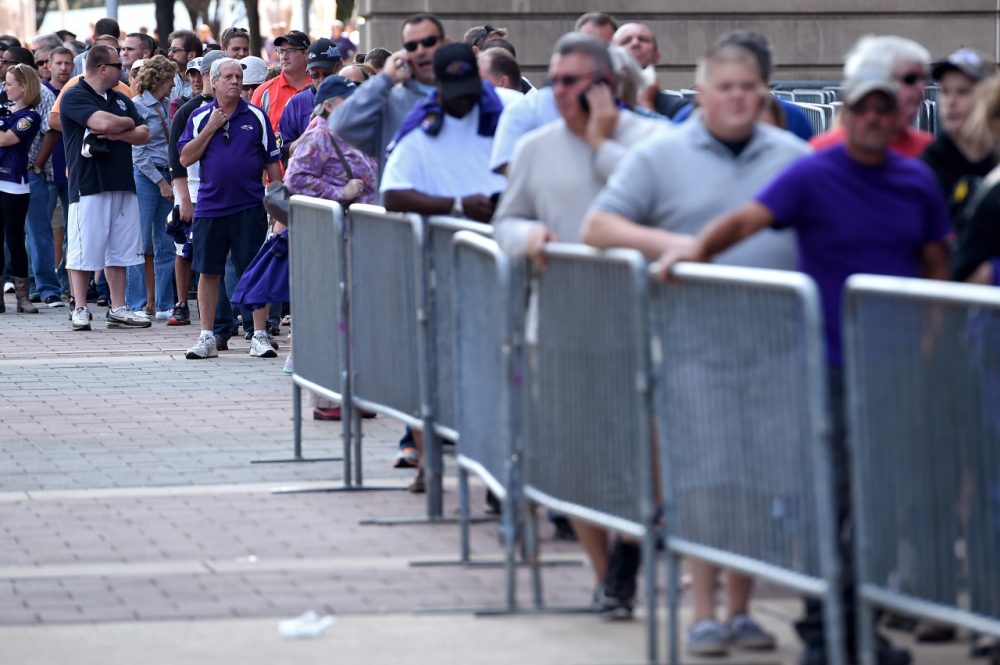 Baltimore Ravens fans stand in line to exchange the jersey of Ray Rice, who is recorded on video knocking out his then-fiance. (Patrick Smtih/Getty Images)