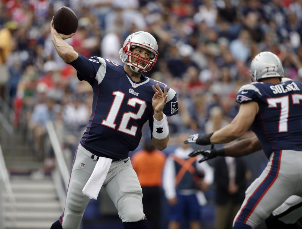 New England Patriots quarterback Tom Brady looks for a receiver against the Oakland Raiders in the first half of the game Sunday, Sept. 21, 2014, in Foxborough, Mass. (Steven Senne/AP)