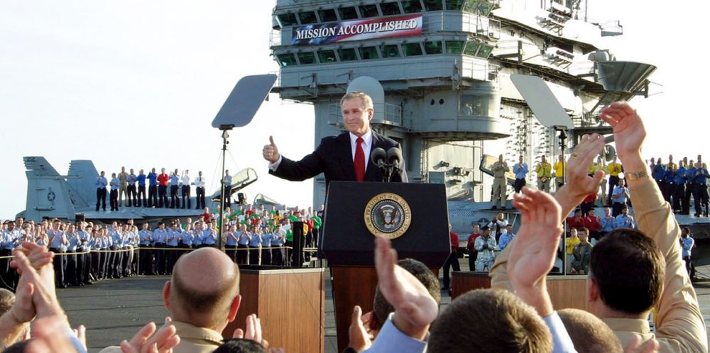 In this May 1, 2003 file photo, President Bush gives a &quot;thumbs-up&quot; sign after declaring the end of major combat in Iraq as he speaks aboard the aircraft carrier USS Abraham Lincoln off the California coast. We take a look back at the U.S.'s century of involvement in Iraq as the U.S. engages ISIS in Iraq and Syria.  (J. Scott Applewhite/AP)