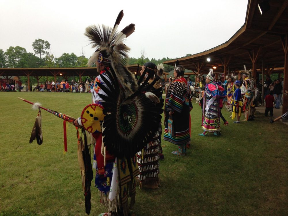 Dancers line up during the Grand Entry at the Hannahville Pow Wow. (Emily Fox/Michigan Radio)