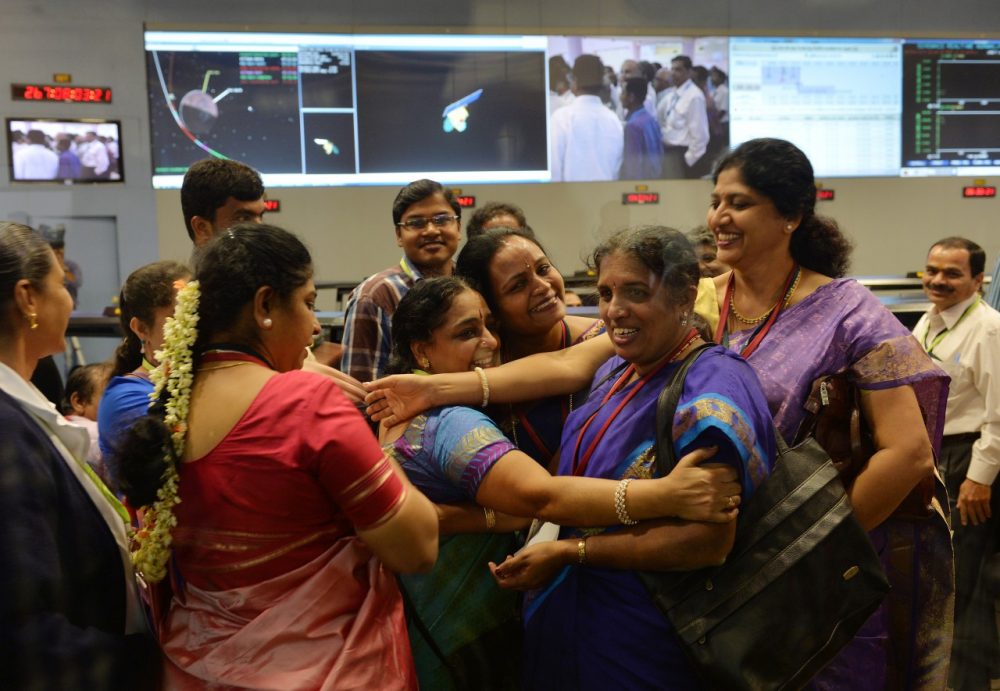 Indian Prime Minister Narendra Modi makes his first visit to the U.S. as India becomes the first Asian nation to reach Mars. Pictured, Indian staff from the Indian Space Research Organisation (ISRO) celebrate in Bangalore after the Mars Orbiter Spacecraft (MoM) successfully entered the Mars orbit on September 24, 2014.(Manjunath Kiran/AFP/Getty Images)